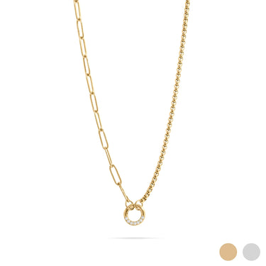 Gold necklace with a small circular pendant on a white background