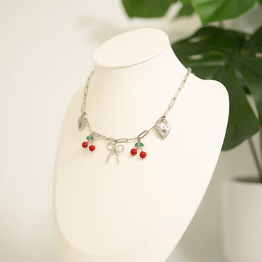 White display with paperclip charm necklace