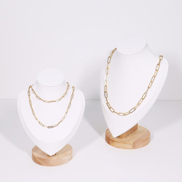 White and wood necklace display showcasing paperclip chain