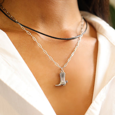 Paperclip chain necklace paired with cowboy boot pendant