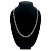 Stainless steel chain necklace with circle knots on a black velvet bust.