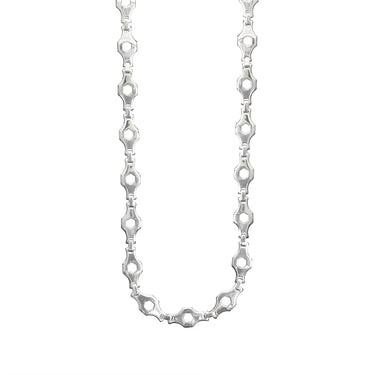 Stainless steel hexagon fancy chain necklace hanging.