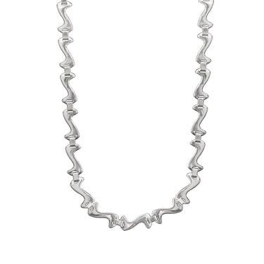 Stainless steel swish wave fancy chain necklace hanging.