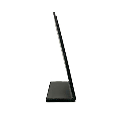 Small black velvet necklace display, side view.