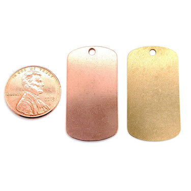 Copper and Brass blank dog tag pendants with a penny for scale.