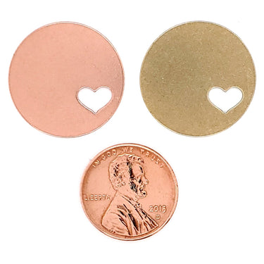 Copper and Brass blank round heart cutout pendant with a penny for scale.