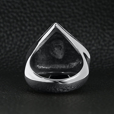 Stainless steel polished skull of spades ace ring back view on a black leather background.