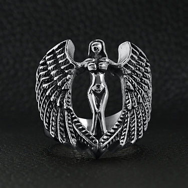 Stainless steel large nude angel ring on a black leather background.