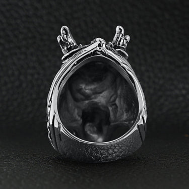 Stainless steel eastern lucky dragon head ring back view on a black leather background.