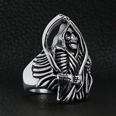 Stainless steel Grim Reaper with scythe ring on a back leather background.