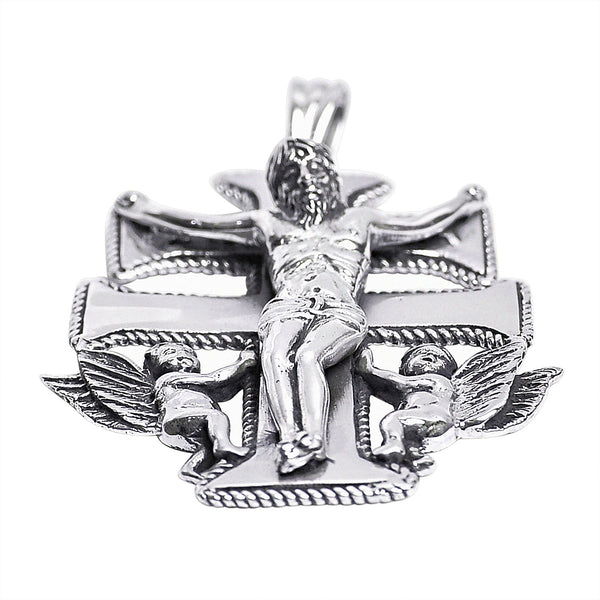 Sterling silver Caravaca Crucifix Cross pendant at an angle.