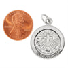 Sterling silver "Confirmation" Cross pendant with a penny for scale.
