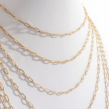 Gold chain necklaces on a white background