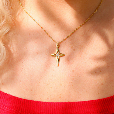 Compass star pendant with CZ stone in center life style