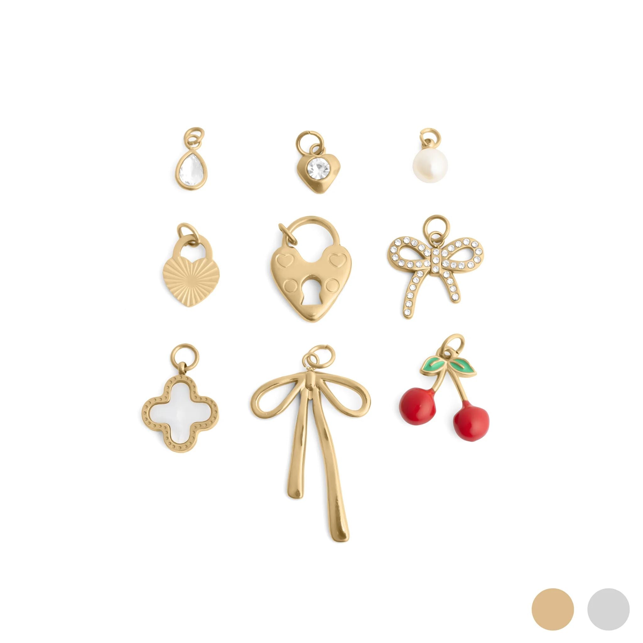 Collection of gold and colorful charms on a white background