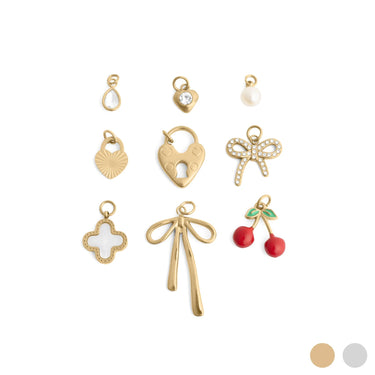Collection of gold and colorful charms on a white background