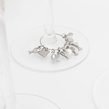 Silver charm bracelet on a white background