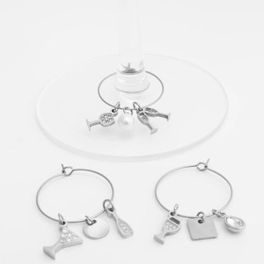 Silver bracelets with charms on a white background