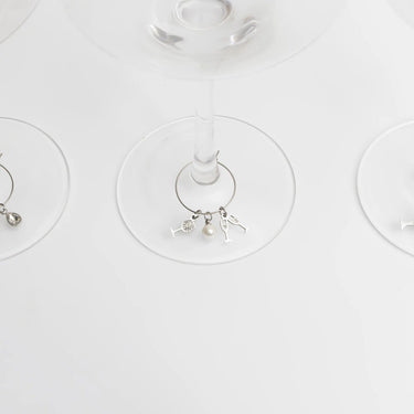 Wine glass charms with charms on a white background