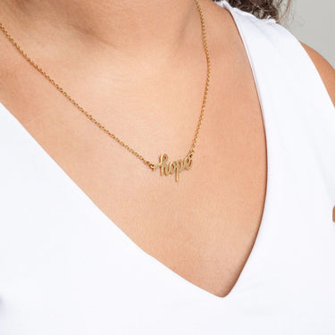 Gold Hope Necklace Gift Seton a person wearing a white top