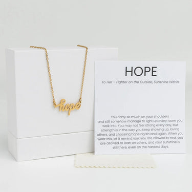 Gold Hope Necklace Gift Set on a white box with a message card.