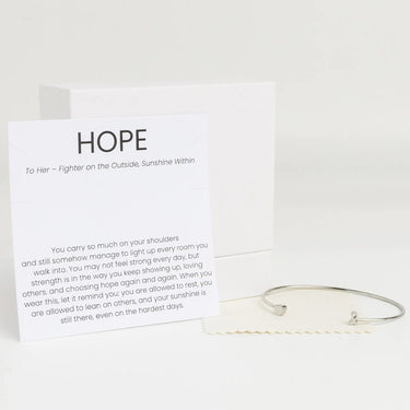 Silver Adjustable Cuff with Cancer Ribbon Charm GIft Set with a card titled 'Hope' on a white background