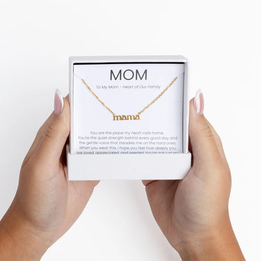 Gold Mama Necklace Gift Set in a 'mama' box held by two hands on a white background