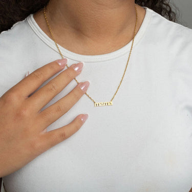 Gold Mama Necklace Gift Set with 'mama' pendant worn by a person on a white background