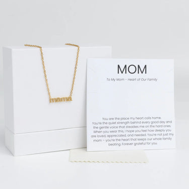 Gold Mama Necklace Gift Set on a white box with a card for 'Mom' on a white background
