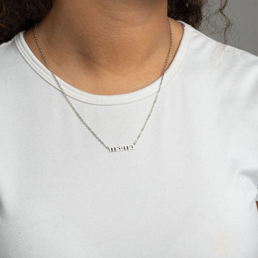 Person wearing a silver Mama Necklace Gift Set with small mama pendant on a plain background