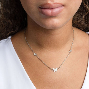 Butterfly Necklace Gift Set worn by a person with a white shirt