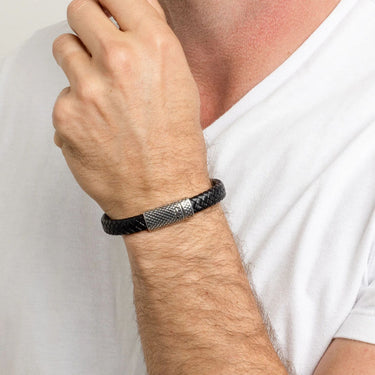 Silver Black braided Mens Leather Metal Clasp Bracelet Gift Set on a wrist with a neutral background