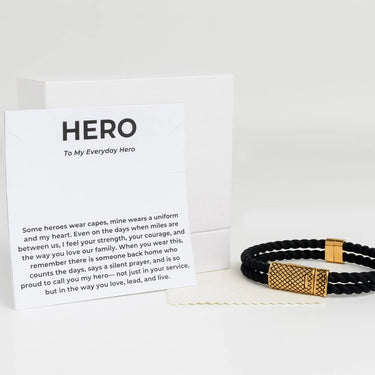 Black and gold Rubber Metal Clasp Bracelet Gift Set with a card labeled 'Hero' on a white background