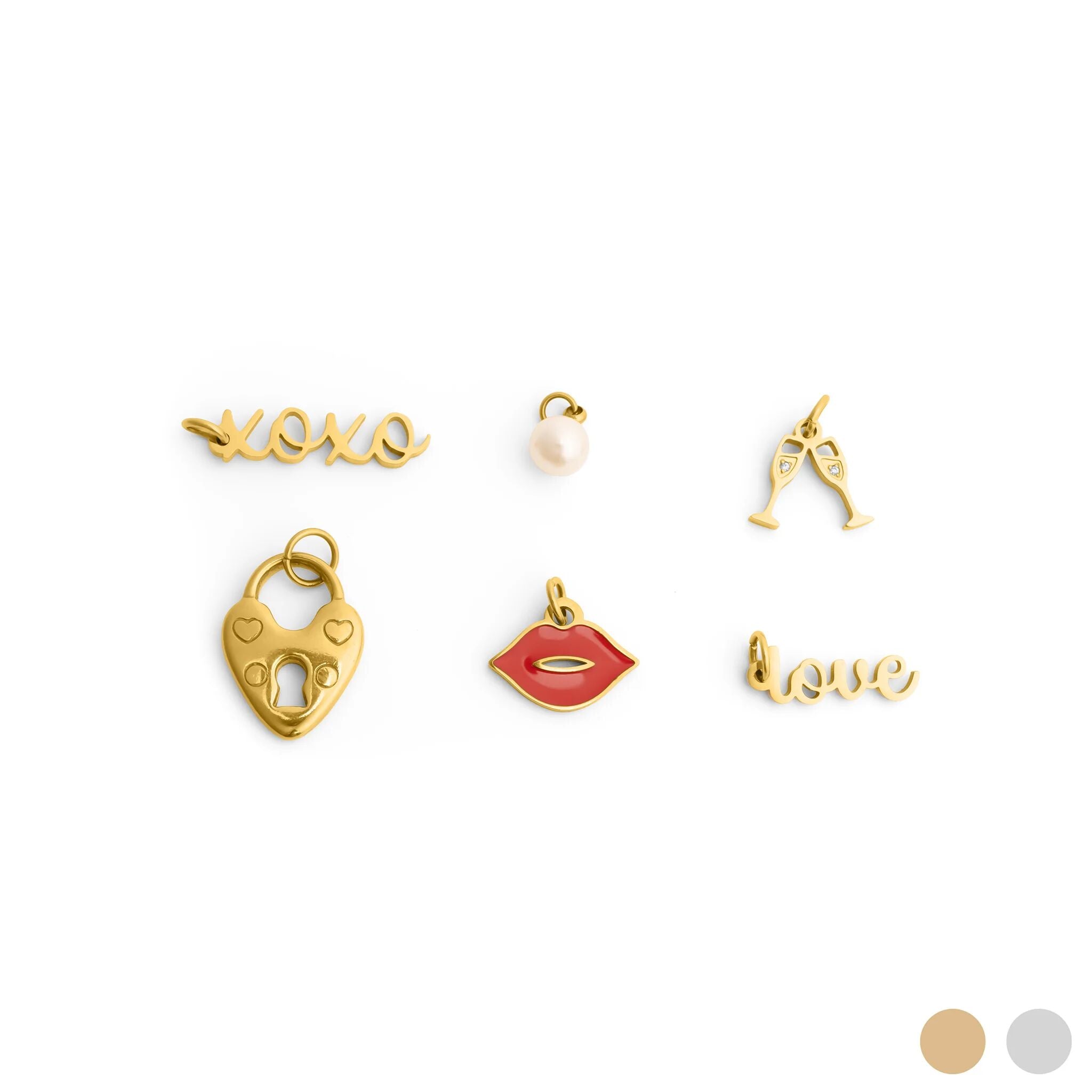 Collection of gold and colorful charms on a white background