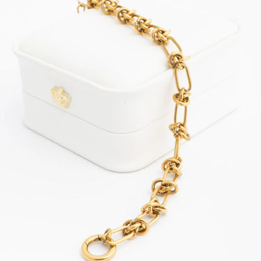 Gold chain accessory on a white background