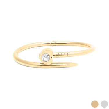 Gold bracelet with a small round gemstone on a white background