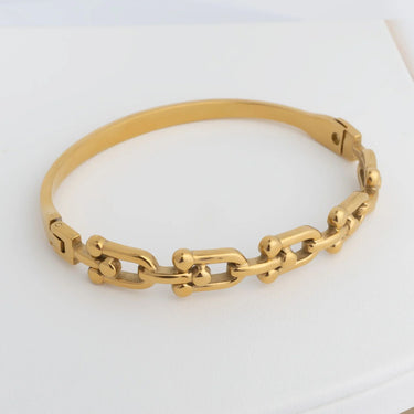 Gold chain bracelet on a white background