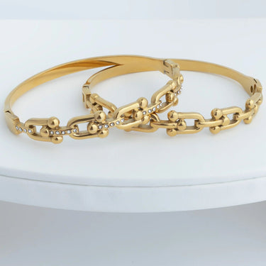 Gold chain bracelet on a white background