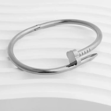 Silver bracelet on a light gray background