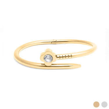 Gold bracelet with a central gemstone on a white background