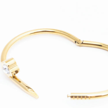 Gold bracelet on a white background