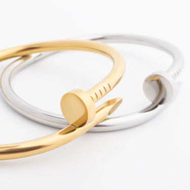 Gold and silver bangles on a white background