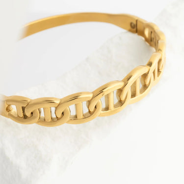 Gold chain bracelet on a white background