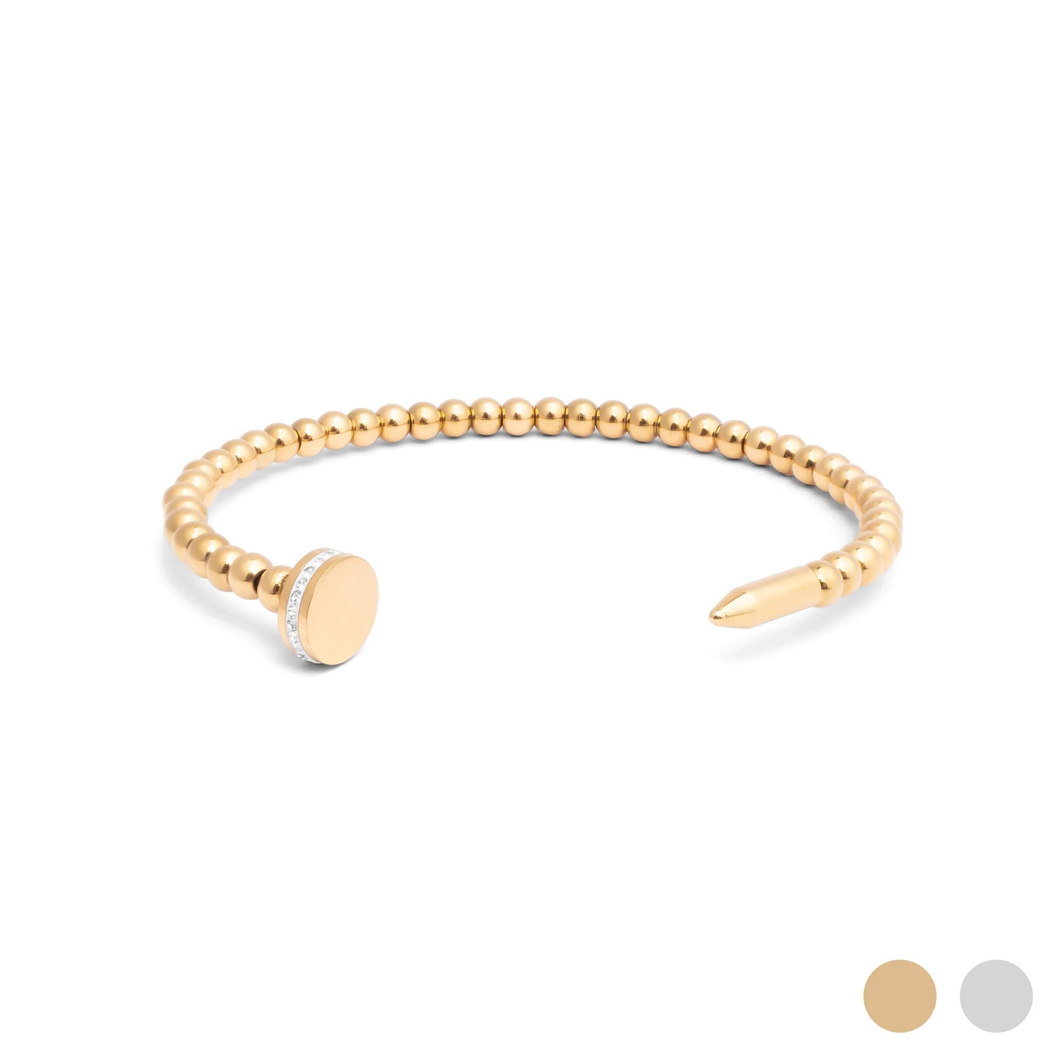 Gold beaded bracelet on a white background