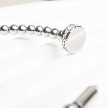 Silver beaded bracelet with a clasp on a white background