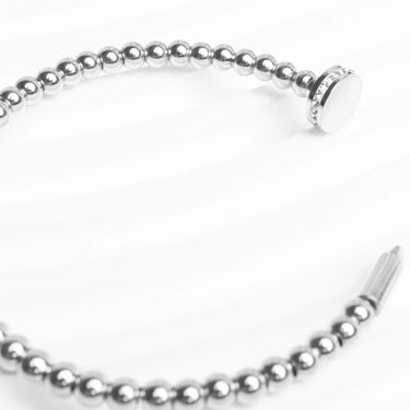 Silver beaded bracelet on a white background