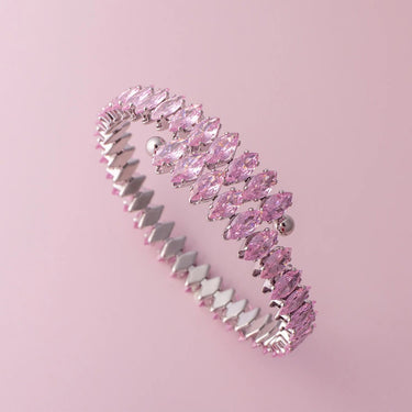 Pink and silver bracelet on a pink background