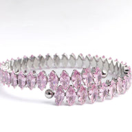 Pink tiara with silver accents on a white background
