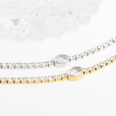 Two diamond bracelets on a white background