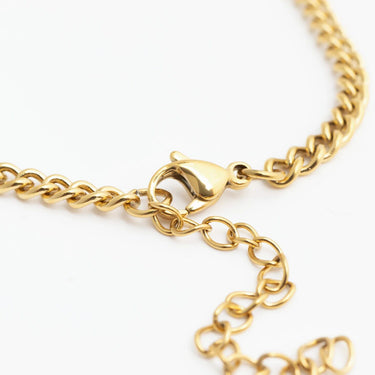 Gold chain bracelet on a white background